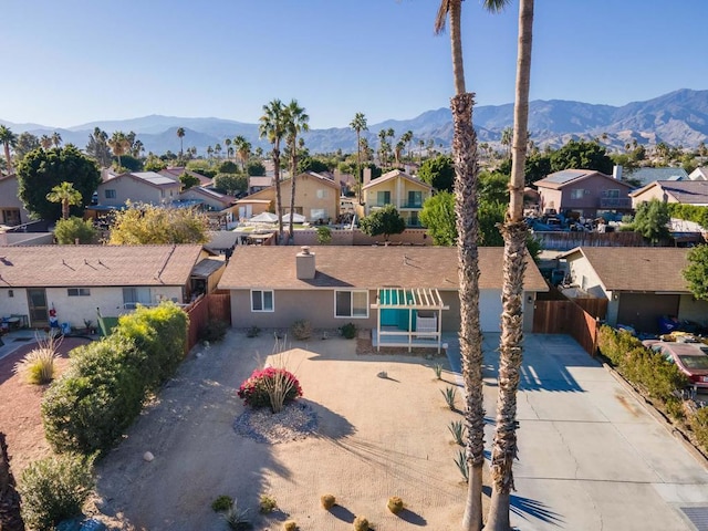 birds eye view of property with a mountain view