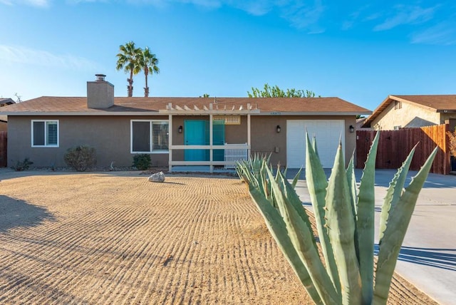 ranch-style home with a garage