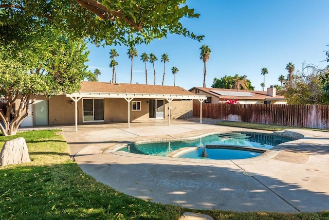 view of swimming pool with an in ground hot tub and a patio