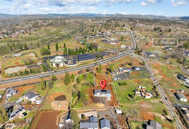 drone / aerial view with a residential view and a mountain view