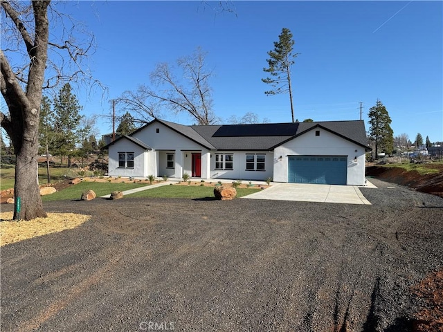 view of front of house with driveway and an attached garage