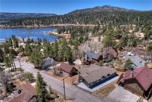 drone / aerial view with a water and mountain view