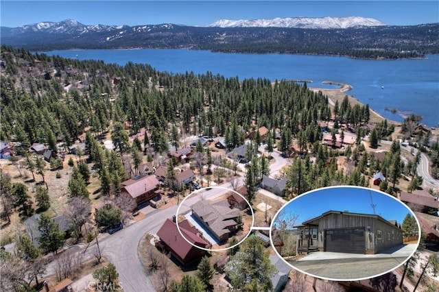 bird's eye view with a water and mountain view