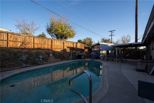 view of pool featuring a patio