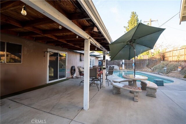 view of patio featuring a fenced in pool