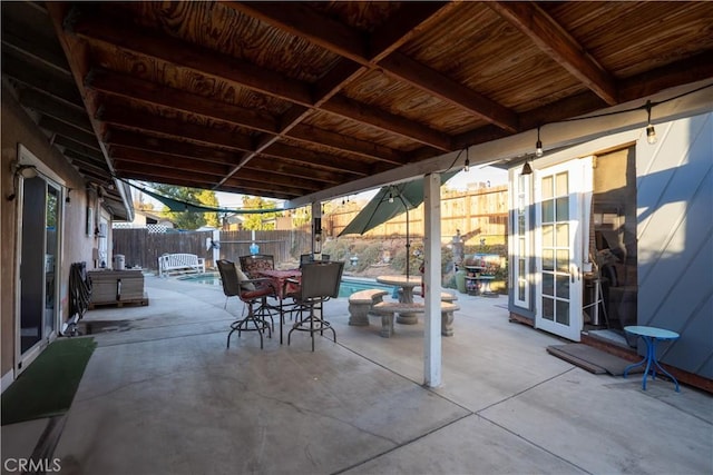 view of patio / terrace with a fenced in pool