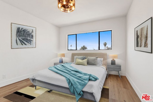 bedroom featuring wood-type flooring