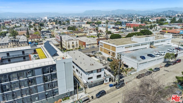 birds eye view of property with a mountain view