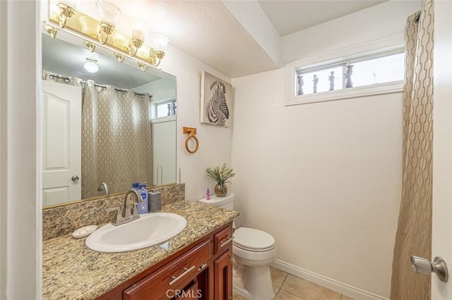 bathroom featuring toilet, vanity, a shower with curtain, and tile patterned floors