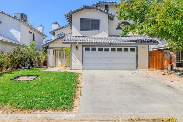 front of property with a garage, a front yard, and central AC unit