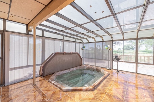 sunroom featuring a jacuzzi