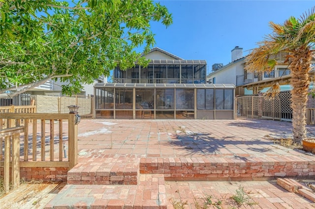 view of patio / terrace featuring a sunroom