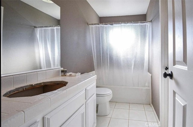 bathroom with toilet, tile patterned flooring, shower / bath combo, and vanity