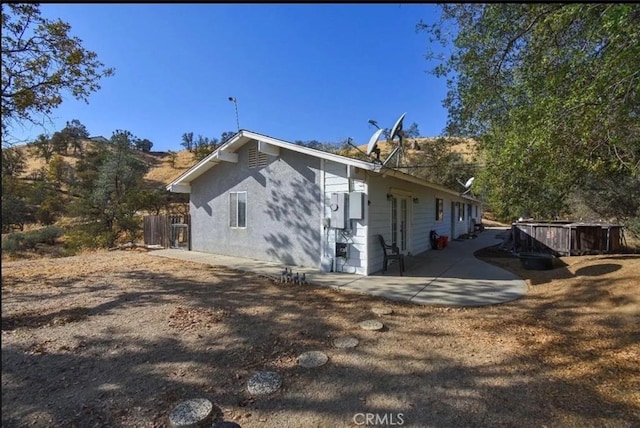 back of property featuring a patio