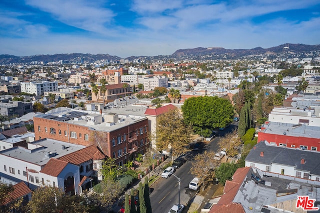 birds eye view of property with a mountain view