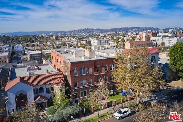 birds eye view of property with a mountain view