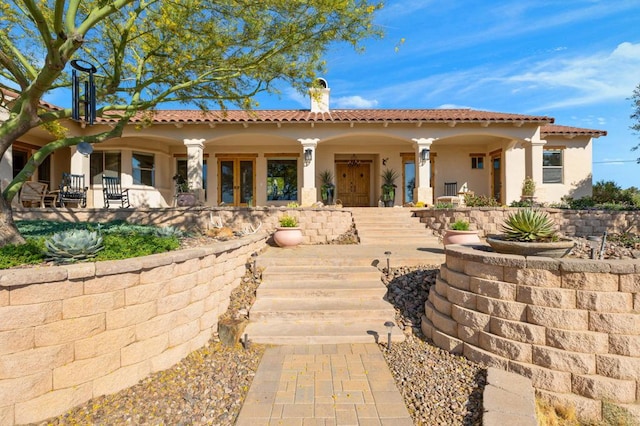 rear view of house with covered porch