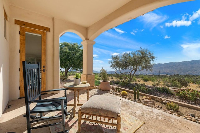 view of patio / terrace with a mountain view