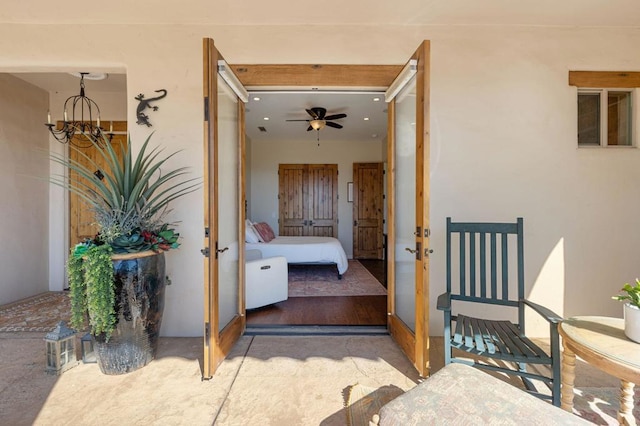 property entrance with ceiling fan