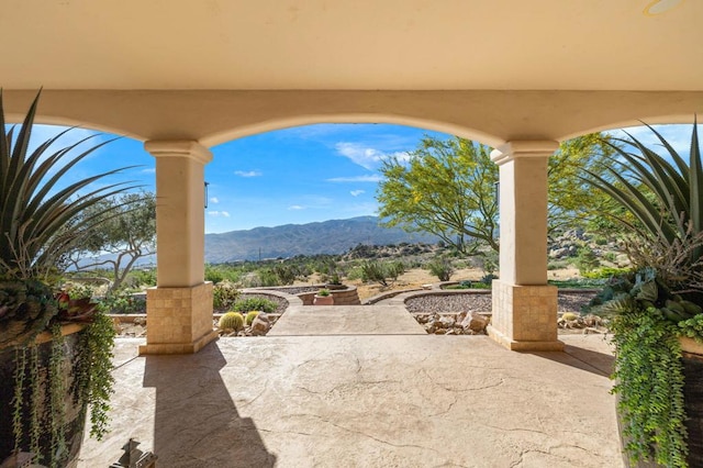 view of patio / terrace featuring a mountain view