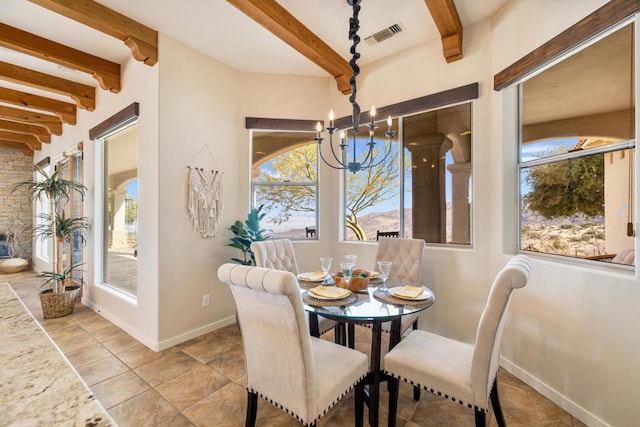 dining space featuring a notable chandelier and beamed ceiling