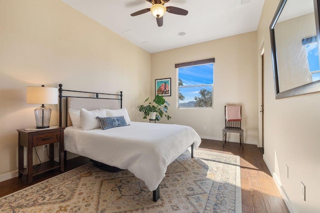 bedroom with ceiling fan and hardwood / wood-style flooring