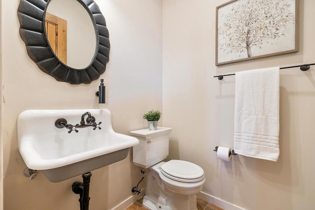 bathroom with toilet and sink