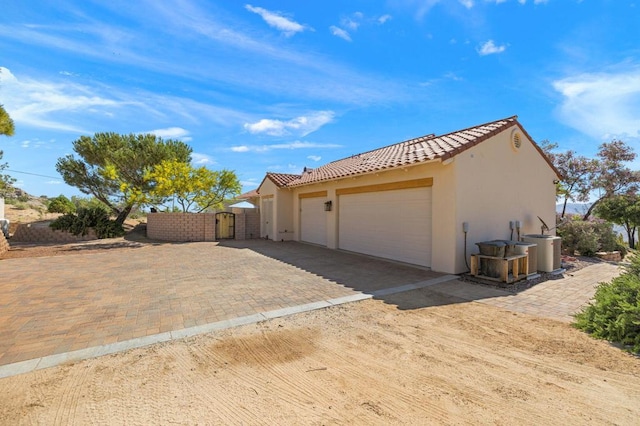 view of side of home featuring central AC