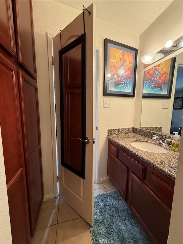 bathroom with vanity and tile patterned floors