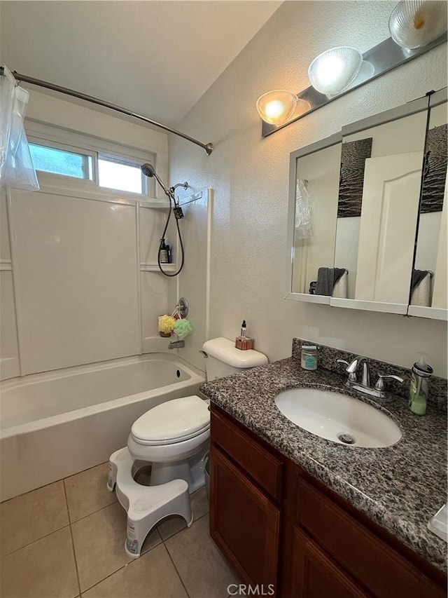 full bathroom featuring toilet, vanity, vaulted ceiling, shower / bathing tub combination, and tile patterned floors