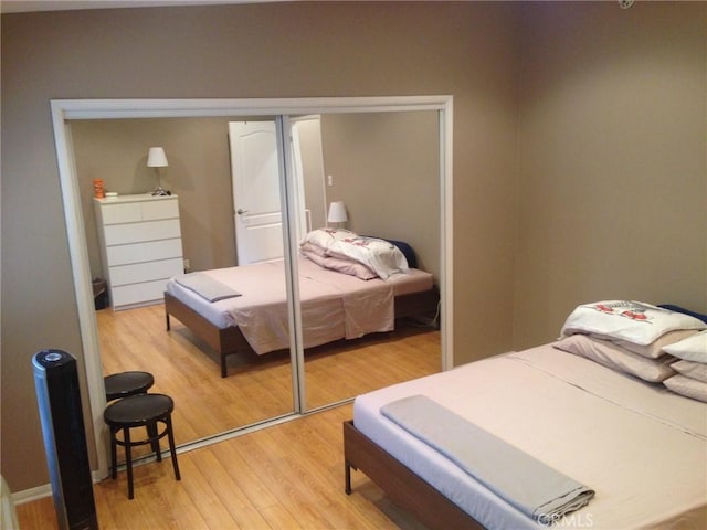 bedroom featuring light wood finished floors