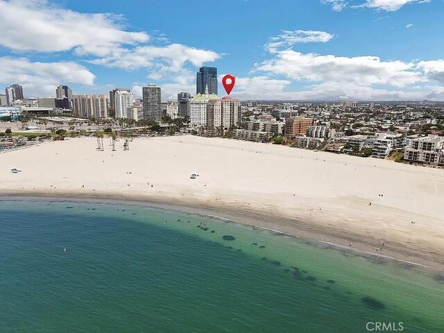 bird's eye view with a beach view and a water view