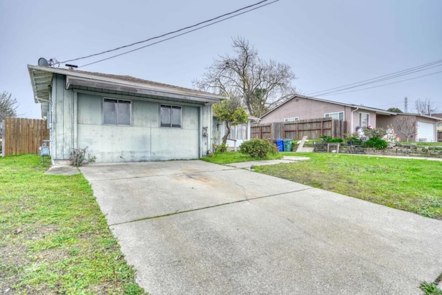 view of side of home with a yard