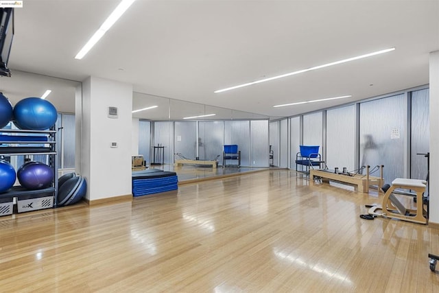 workout room with light wood-type flooring