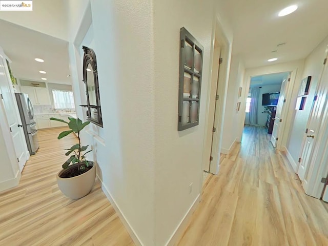 hallway featuring light hardwood / wood-style floors