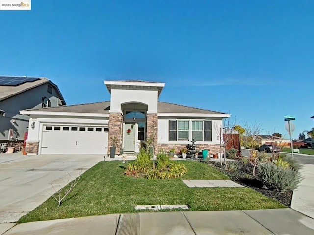 view of front of house with a front lawn and a garage