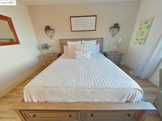 bedroom with wood-type flooring