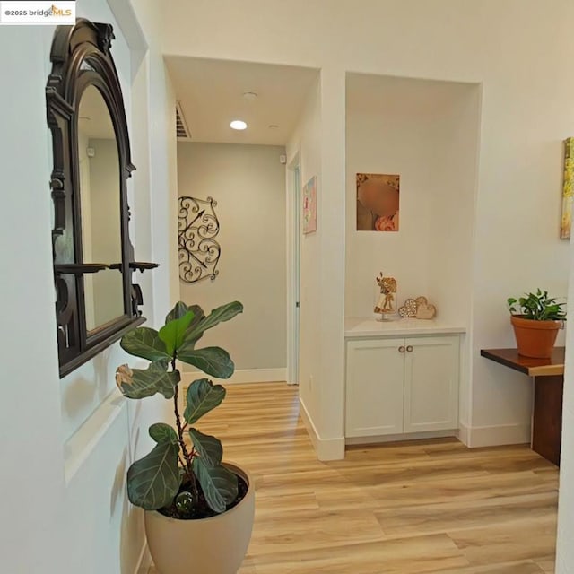 hallway featuring light wood-type flooring