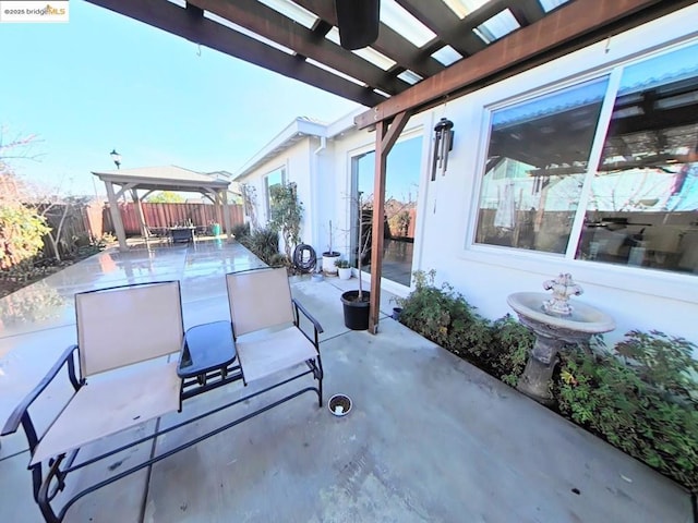 view of patio with a gazebo and a pergola