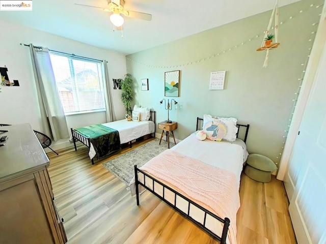 bedroom featuring ceiling fan and light hardwood / wood-style floors