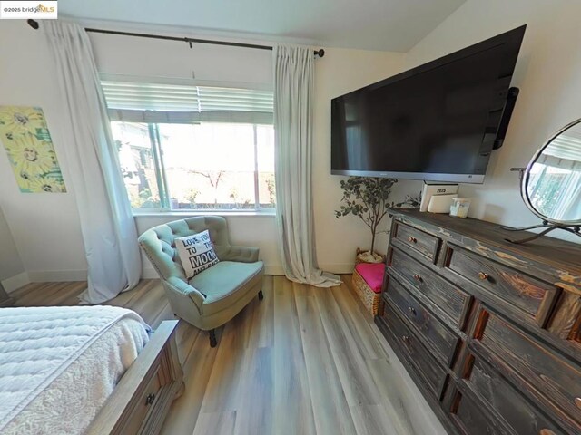 bedroom with light hardwood / wood-style floors