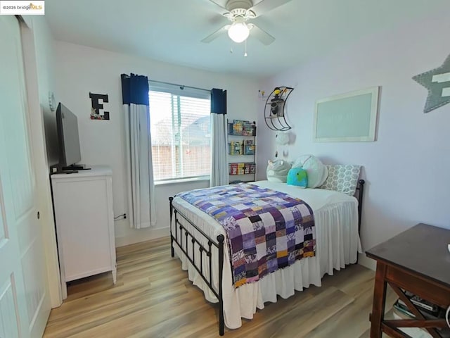 bedroom featuring ceiling fan and light wood-type flooring