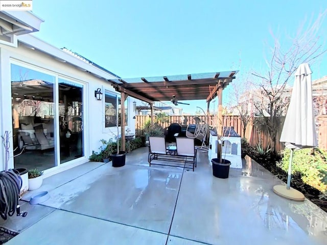 view of patio featuring ceiling fan and a pergola