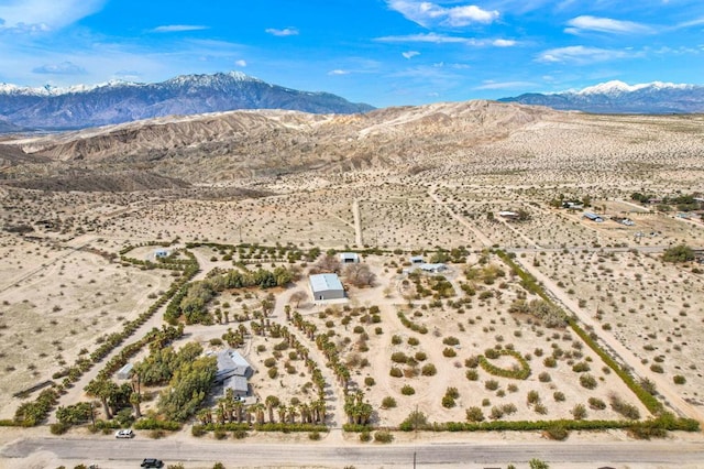 birds eye view of property with a mountain view