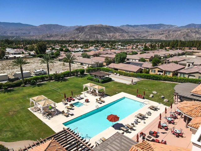 view of swimming pool featuring a mountain view