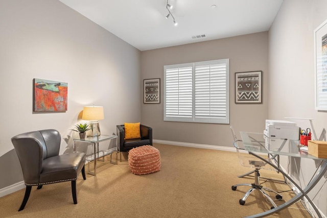 home office featuring rail lighting and carpet flooring