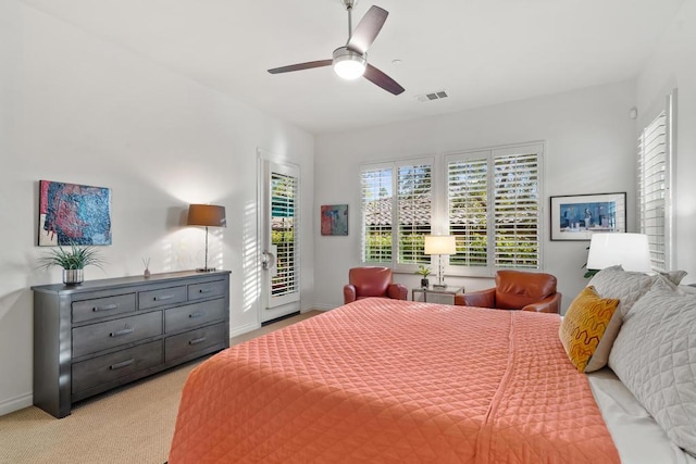 carpeted bedroom featuring access to outside and ceiling fan