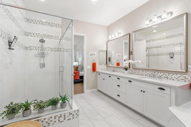 bathroom featuring decorative backsplash, tiled shower, and vanity