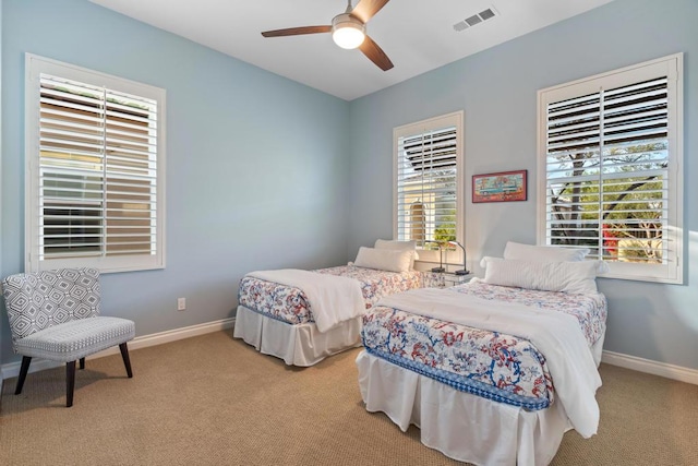 bedroom with ceiling fan and light colored carpet