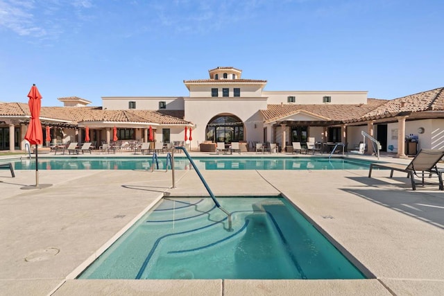 view of pool featuring a patio